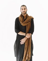 Young man posing casually over white wall. Studio, isolated.